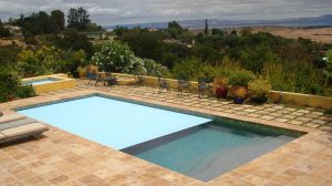 Noce travertine tiles and pool coping